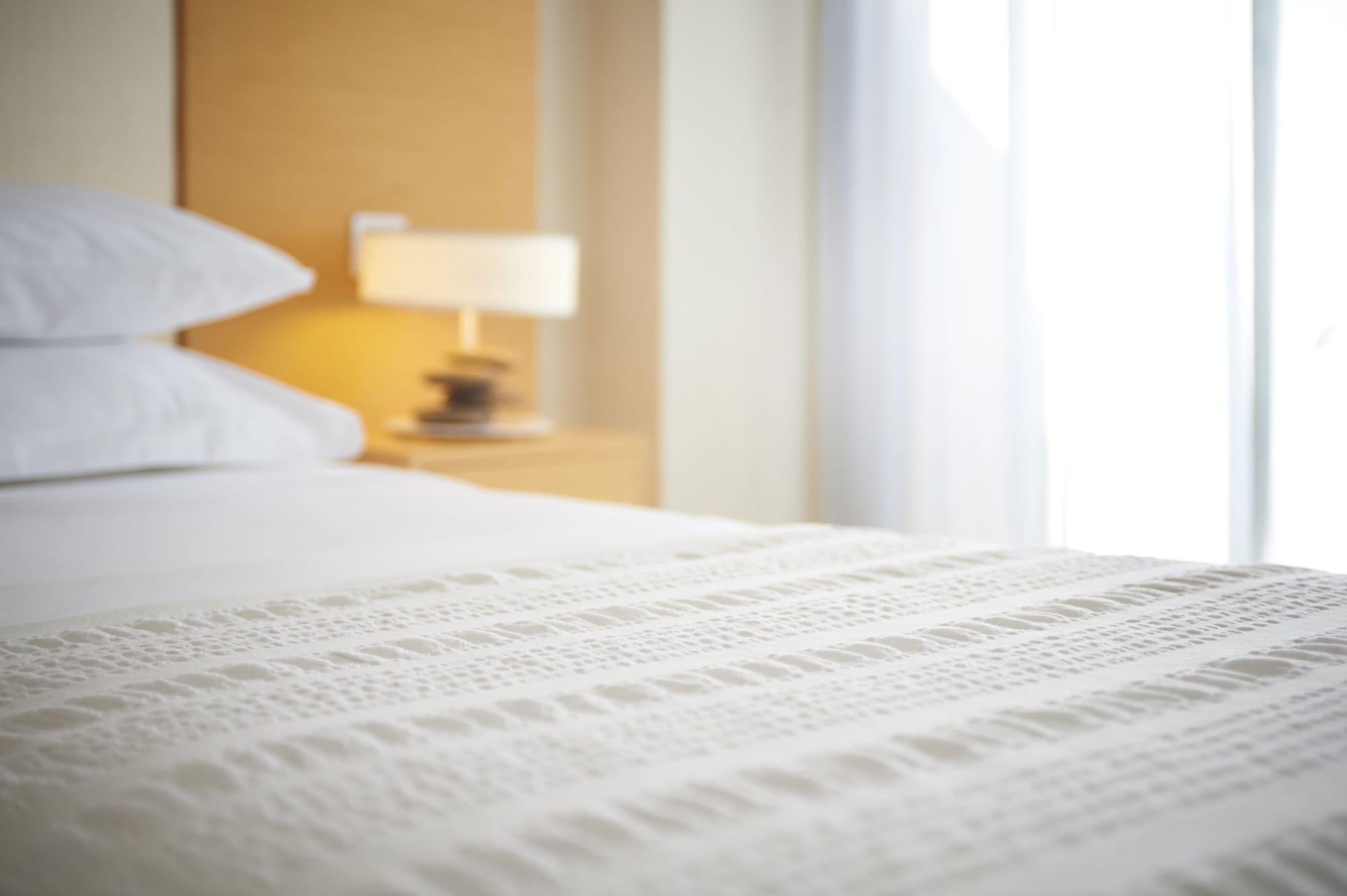 Capo Bay Hotel Протарас Екстериор снимка A bed