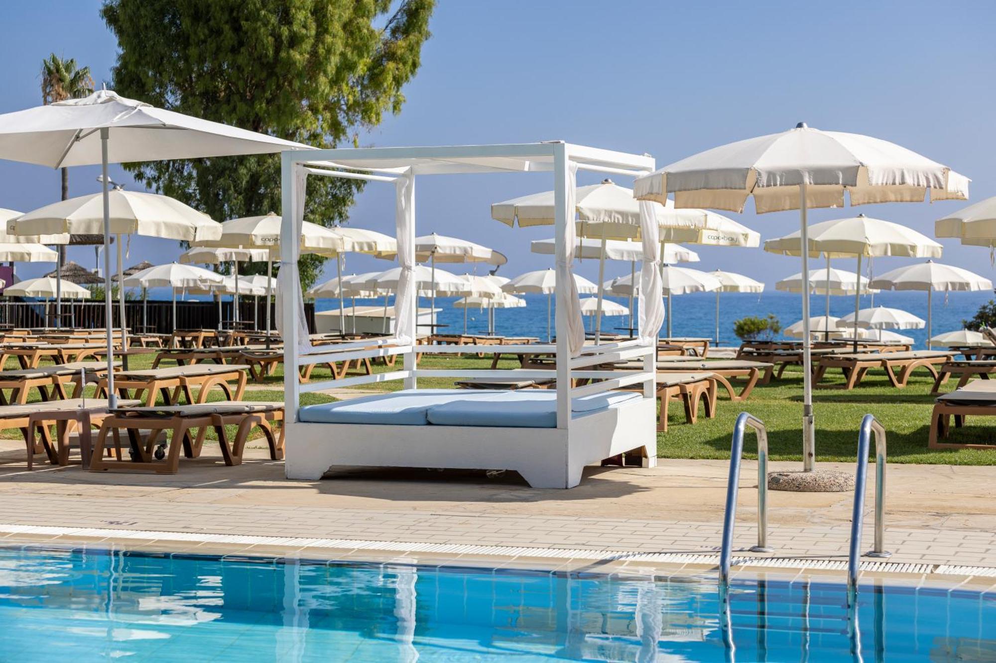 Capo Bay Hotel Протарас Екстериор снимка Pool at the Grand Resort